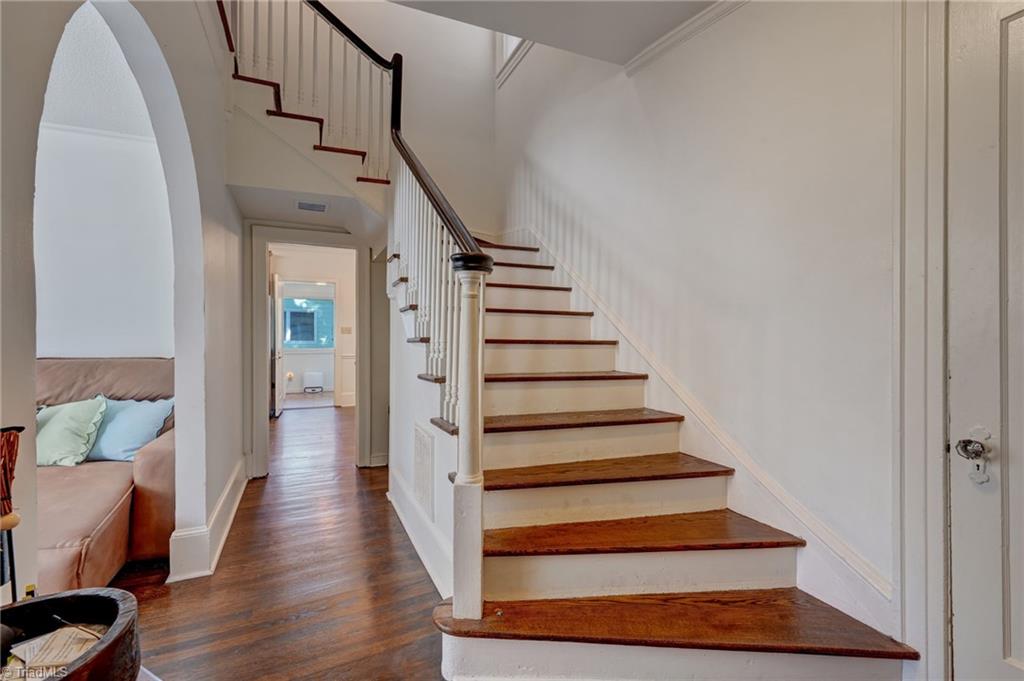 Curved staircase and arched doorway